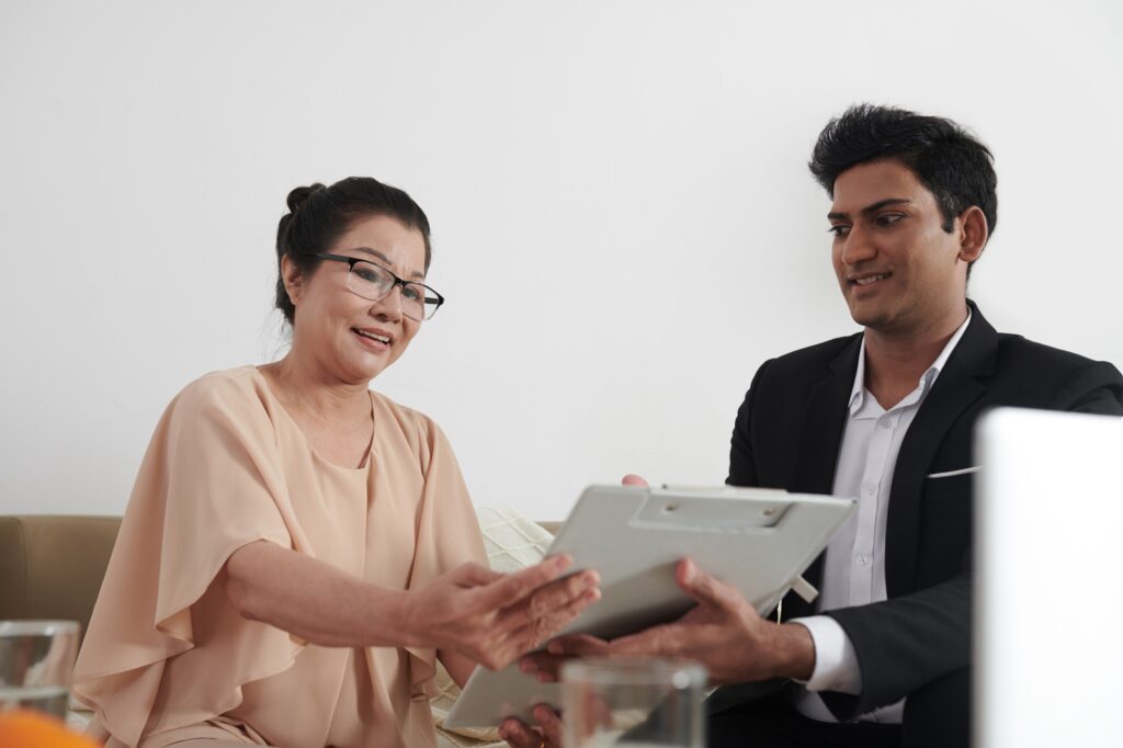 Insurance Agent Helping Senior Client